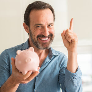 A man holding a piggy bank