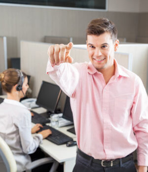 Customer Service Booster (February 2022) 10 Customer service team leader smiling and pointing