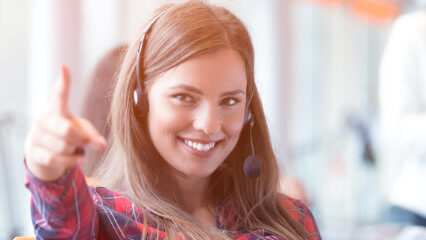 Customer Service Booster (February 2022) 1 Smiling customer service employee on the phone