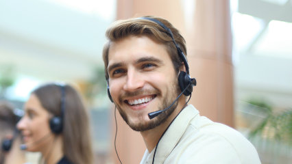 Customer Service Professionals (February 2022) 1 Male customer service agent smiling