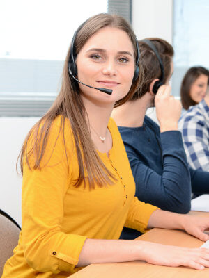 Contact centre customer service worker smiling with headset