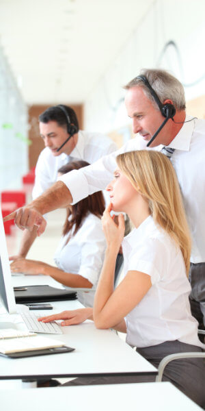 call centre manager helping a call centre worker