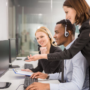 call centre manager helping frontline agent