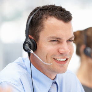 Smiling male call centre agent